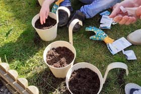 Josh Cupples gets to work on his gardening badge.