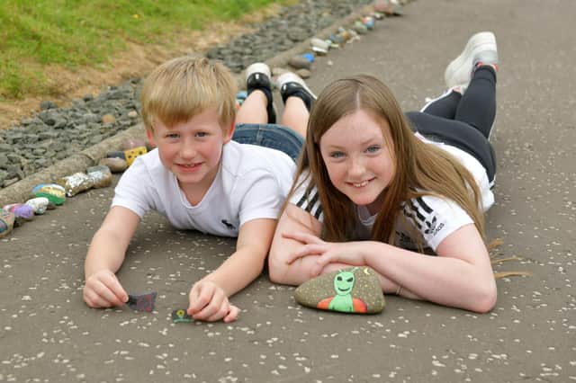 Lucy (10) and Josh (6) Murray tarted a 'lockdown caterpillar' inviting people to paint stones and add them to the head to create a caterpillar.  It's now over 25 metres long.