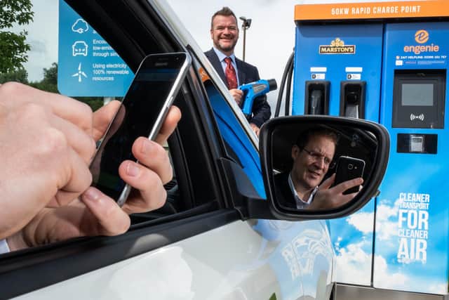 Stock photo from last August of Scott Mathieson of SP Energy Networks and Mike Gill  of Bo’ness-based digital company, Sanctus Media, at the launch of a charge point app.