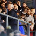 Former Falkirk player Stephen Kingsley (camel coat and gold glasses) watched Falkirk v Dumbarton earlier this year. Picture: Michael Gillen.