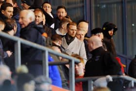 Former Falkirk player Stephen Kingsley (camel coat and gold glasses) watched Falkirk v Dumbarton earlier this year. Picture: Michael Gillen.