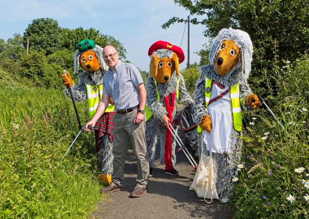 John Hamilton, CEO, Winchburgh Developments with the Winchburgh Wombles, formed by a group of local volunteers, who will meet every week to pick litter across seven separate routes throughout the village.