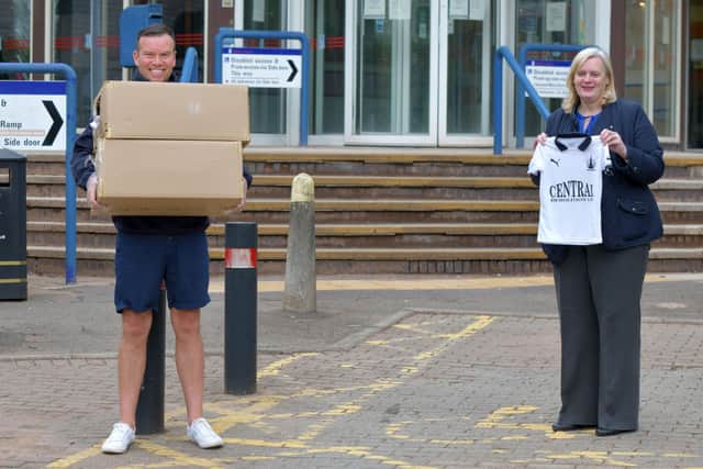 Kieran Koszary delivered strips to Falkirk Council and leader Cecil Meiklejohn. Picture:  Michael Gillen.