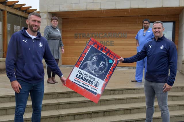 Lee Miller, Falkirk FC manager; Margaret Morgan, Strathcarron Hospice fundraising finance assistant; Dr Tapajauti Chaudhury, hospice physician and David McCracken, Falkirk FC manager launched the season tickets for the new campaign. Picture: Michael Gillen.