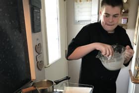 Scout badge work includes cooking a three-course meal.