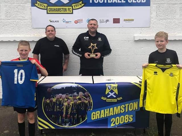 2008 head coach Craig Wilson picked up his award while the team received new kits