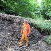 Engineer Andrew Anderson at the site of the landslip.