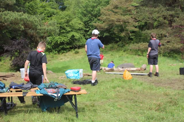 Scouts practicing social distances during activities.