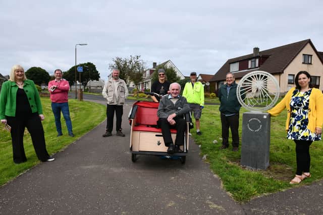 Jim Clark (81) enjoying a tour of new Larbert coins, courtesy of Mandy Brown (Falkirk Council) and Cycling Without Age and Councillor Gary Bouse. Pitured Cecil Meiklejohn, Gary Bouse, Neil Clark, Mandy Brown, Jim Clark, Harry Wilson, CWA pilot, John McNally and Laura Murtagh.