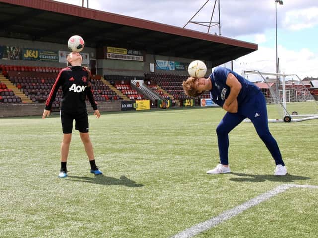 Olivia and Ross shwoing off their freestyle skills at Stenhousemuir FCs Ochilview Park