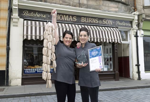 Jane Ross (left) and her sister Emma Burns of Thomas Burns & Son Butchers in Boness with their Scottish Craft Butchers Diamond Award for best Speciality Sausage 2020.  Pic: Graeme Hart.