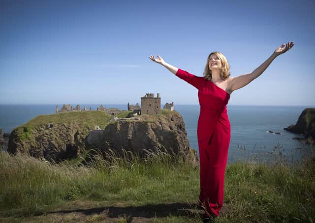 Scottish singer, song-writer and broadcaster Fiona Kennedy on the clifftop overlooking Dunnottar Castle. Photo: Jane Barlow/PA Wire