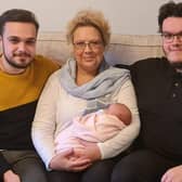 New arrival...Fiona Morris was able to celebrate the birth of her first grandchild Iona Louise last month with her sons, the proud dad Liam (left) and uncle Rian.