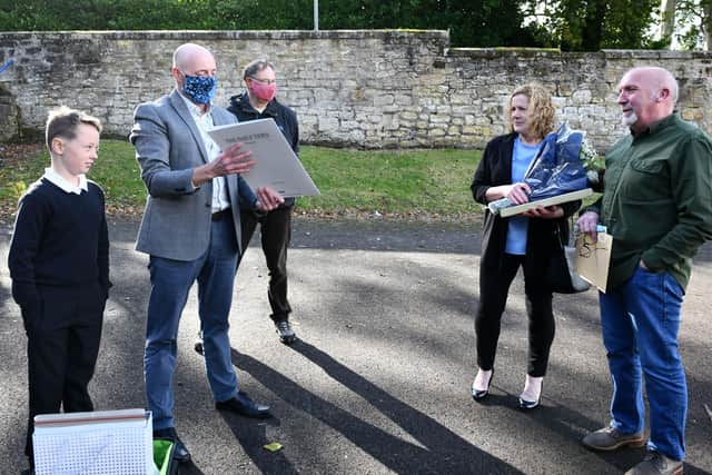 A presentation of a monetary gift of over £1200 from staff, pupils, parents and Grange Parent Council, also other gifts, whisky, framed prints etc. Eric Ross pictured with wife Jean Ross. Picture: Michael Gillen.