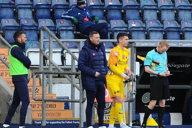 Lee Miller (1st left) looks on as sub keeper PJ Morrison gets set to take the field against Forfar (Pic by Michael Gillen)