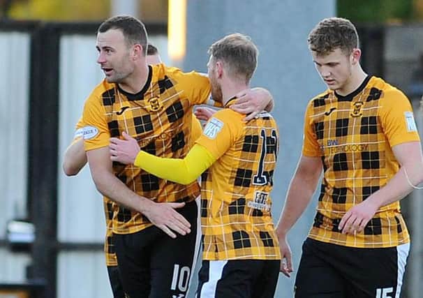 East Fife skipper Kevin Smith takes the plaudits after putting his side a goal up. Pic by Michael Gillen.