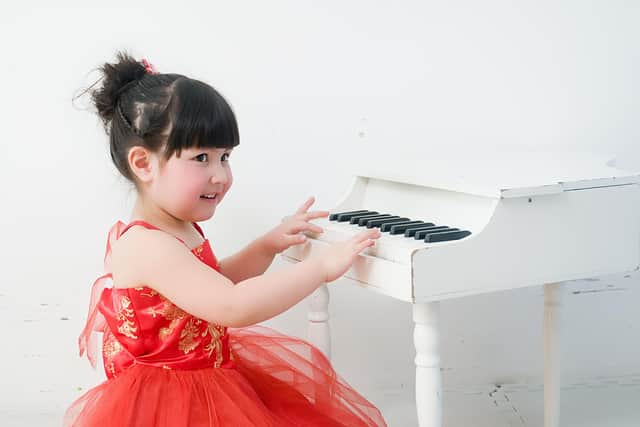 Amanda Slater playing the piano when she was four.