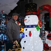 George Barnett has decorated his home and garden with an array of Christmas decorations and lights. Photo by Michael Gillen.