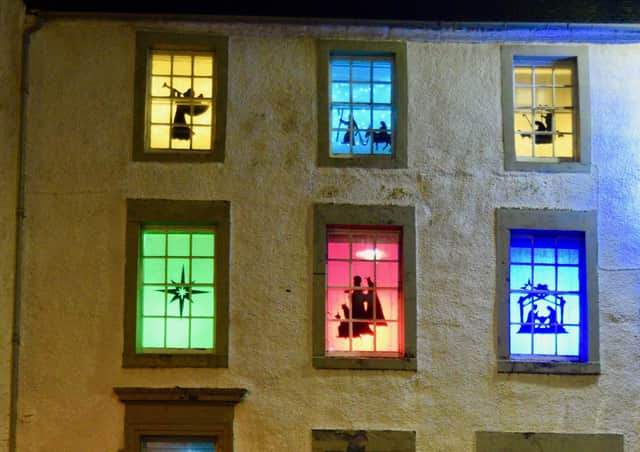 The windows at the front of Cross House facing out onto Linlithgow Cross  have been decorated with back-lit nativity scenes,