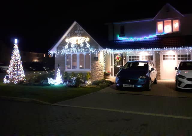 Just one of the many homes with Christmas lights in Kirkliston.