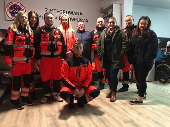 Members of Bridge to Unity, from Emsworth, delivering supplies to the border between Poland and Ukraine to help Ukrainian refugees. Pictured with aid workers in Poland after dropping off supplies