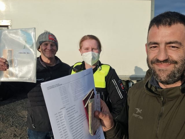 German police officer checking documents 2022 PPP-220603-152525001