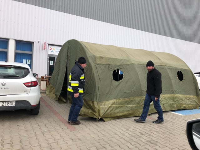 Members of Bridge to Unity are helping with tents
