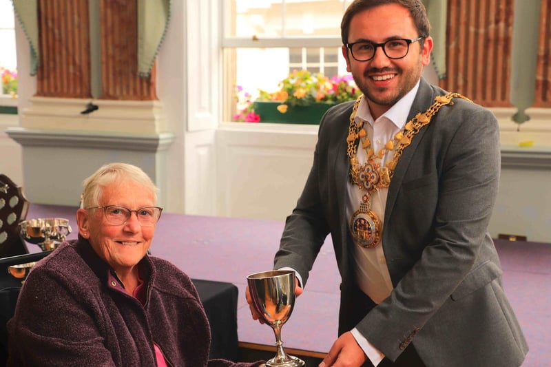 Stephanie Burdett being presented a trophy by Warwick Mayor, Cllr Richard Edgington. Photo supplied