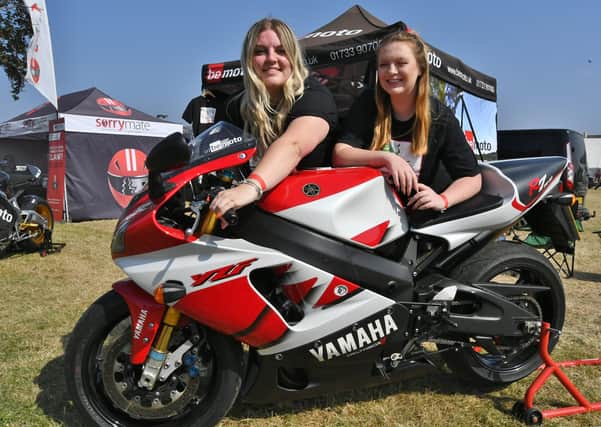 MCN Festival of Motorcycling at the East of England Arena.    Kesley Duberry and Amelia Scholes with one of the most expensive bikes at the show on the Peterborough based insurers " bemoto" EMN-210509-175252009