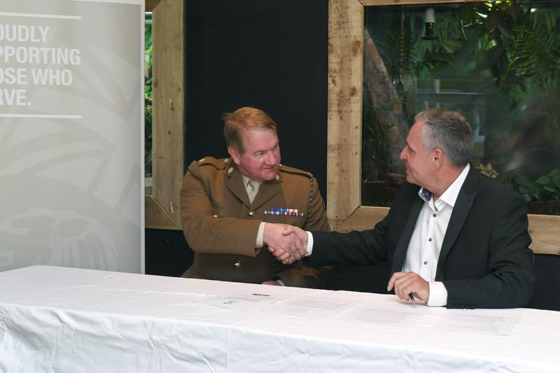 Steve Nichols, the Chief Executive of Lincolnshire Wildlife Park, shakes hands with Major Mitch Pegg, Officer Commanding of the 3rd Battalion The Royal Anglian Regiment, after the signing of the covenant.
