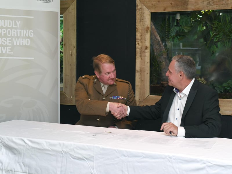 Steve Nichols, the Chief Executive of Lincolnshire Wildlife Park, shakes hands with Major Mitch Pegg, Officer Commanding of the 3rd Battalion The Royal Anglian Regiment, after the signing of the covenant.
