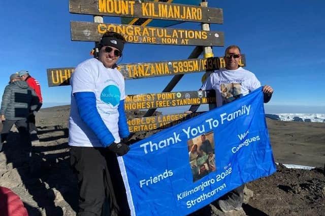 Ryan and Kevin reach the summit of Kilimanjaro