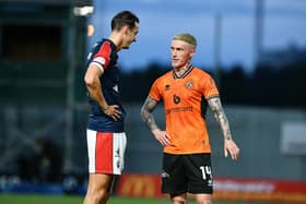 Liam Henderson and ex-Falkirk star Craig Sibbald at the end of the Viaplay Cup tie earlier this campaign - which saw Dundee United prevail 1-0 (Photo: Michael Gillen)