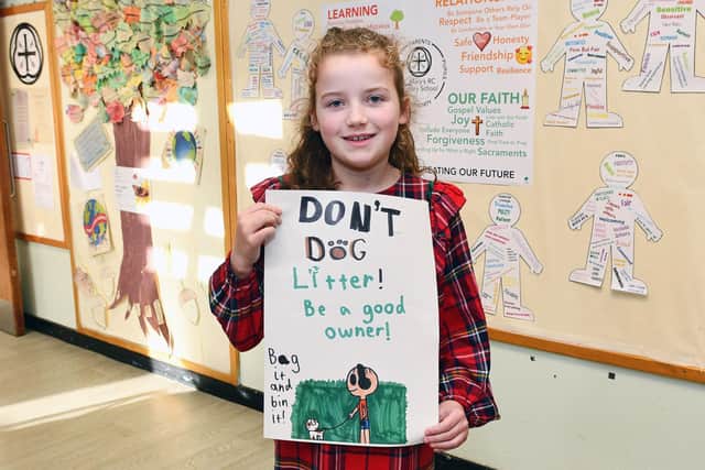 Elvie McCracken of P5 with her winning dog fouling poster. Pic: Michael Gillen