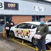 Candied Ice Cream owner Amrit Dhillon and the Candied team hand over 24 Samsung tablets worth a total of £5000. to Norman Philip pf Barnardo's Falkirk Pathways