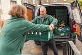 Volunteers unpack food donations at a food bank