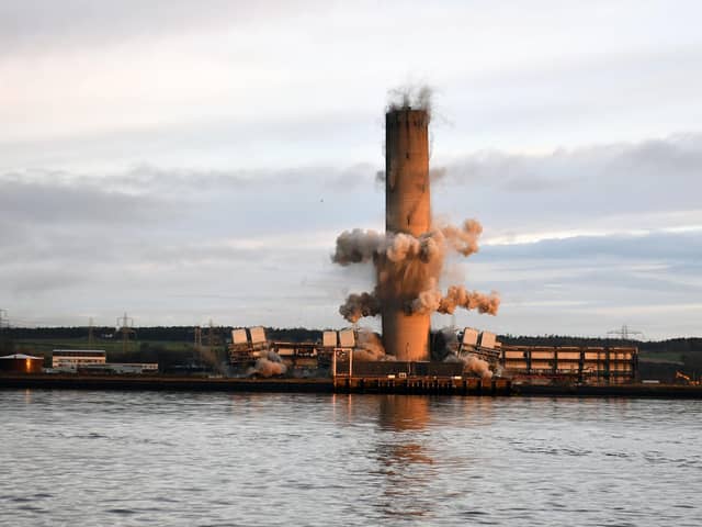 The 600ft chimney at the site of Scotland's last remaining coal fired power station came down this morning.