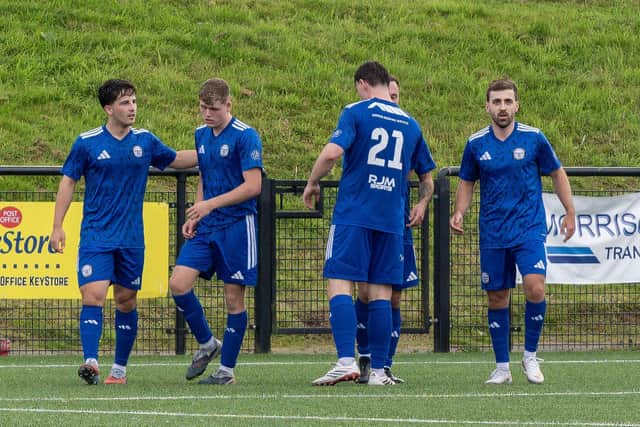 Chris Ogilvie, far right, is mobbed by his team-mates after scoring East Stirlingshire’s third goal against Danny Smith’s Dunipace last Saturday at DCL Westfield (Pictures by Michael Gillen)