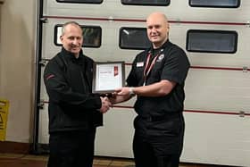 Retained firefighter Graeme Mackie who retired after 32 years with Scottish Fire & Rescue Service in February 2023. Receiving presentation from Group commander Stewart Watson