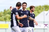 Deniss Meļņiks congratulates Liam Henderson after his team-mate scored against Stranraer – the duo have struck up a strong partnership (Pictures by Ross MacDonald/SNS Group)