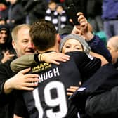 12-04-2016. Picture Michael Gillen. EDINBURGH. Easter Road Stadium. Hibernian FC v Falkirk FC. SPFL Championship. Bob McHugh 19 celebrates at the end of the game with girl friend and dad (right).