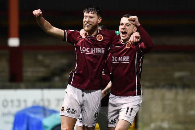 Matthew Aitken celebrates with Adam Brown (Photo: Michael Gillen)