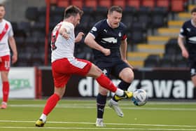 Falkirk captain Stephen McGinn in action against Airdrie's Callum Gallagher (Pictures by Michael Gillen)
