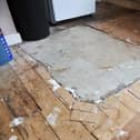 The tiles containing asbestos in the tenant's kitchen have exposed for over a year
