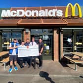 Falkirk restaurant team and Galaxy Foundation at cheque handover.