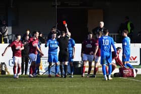 Bo’ness United defender Keir Macauley is shown a straight red card during the second half of last Saturday’s local Lowland League derby clash at Prestonfield (Pictures by Michael Gillen)