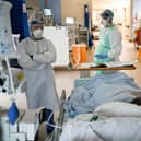 Staff at University Hospital Monklands attend to a Covid-positive patient on the ICU ward on February 5, 2021 in Airdrie, Scotland. TPhoto by Jeff J Mitchell/Getty Images