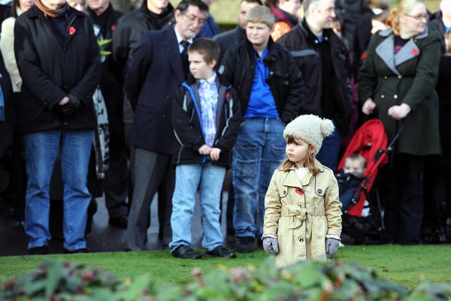 Zetland Park. Remembrance Service at War Memorial. One young observer.