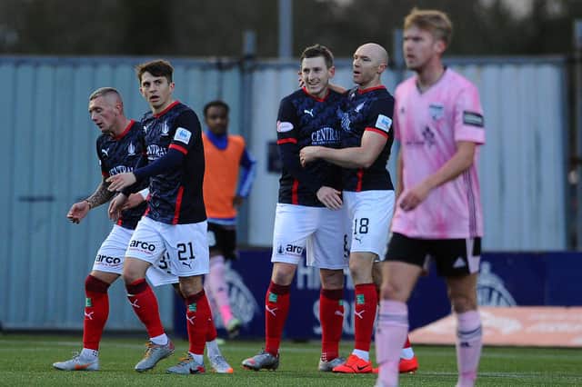 Blair Alston, third from left, receives his team mates' plaudits after opening the scoring for Falkirk in the 25th minute of their home game on Saturday at Peterhead (picture by Michael Gillen).