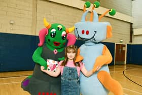 Original Gala mascot, Bella with design competition winner Abbie McMahon and new mascot, Bill.   (Pic: Michael Gillen)